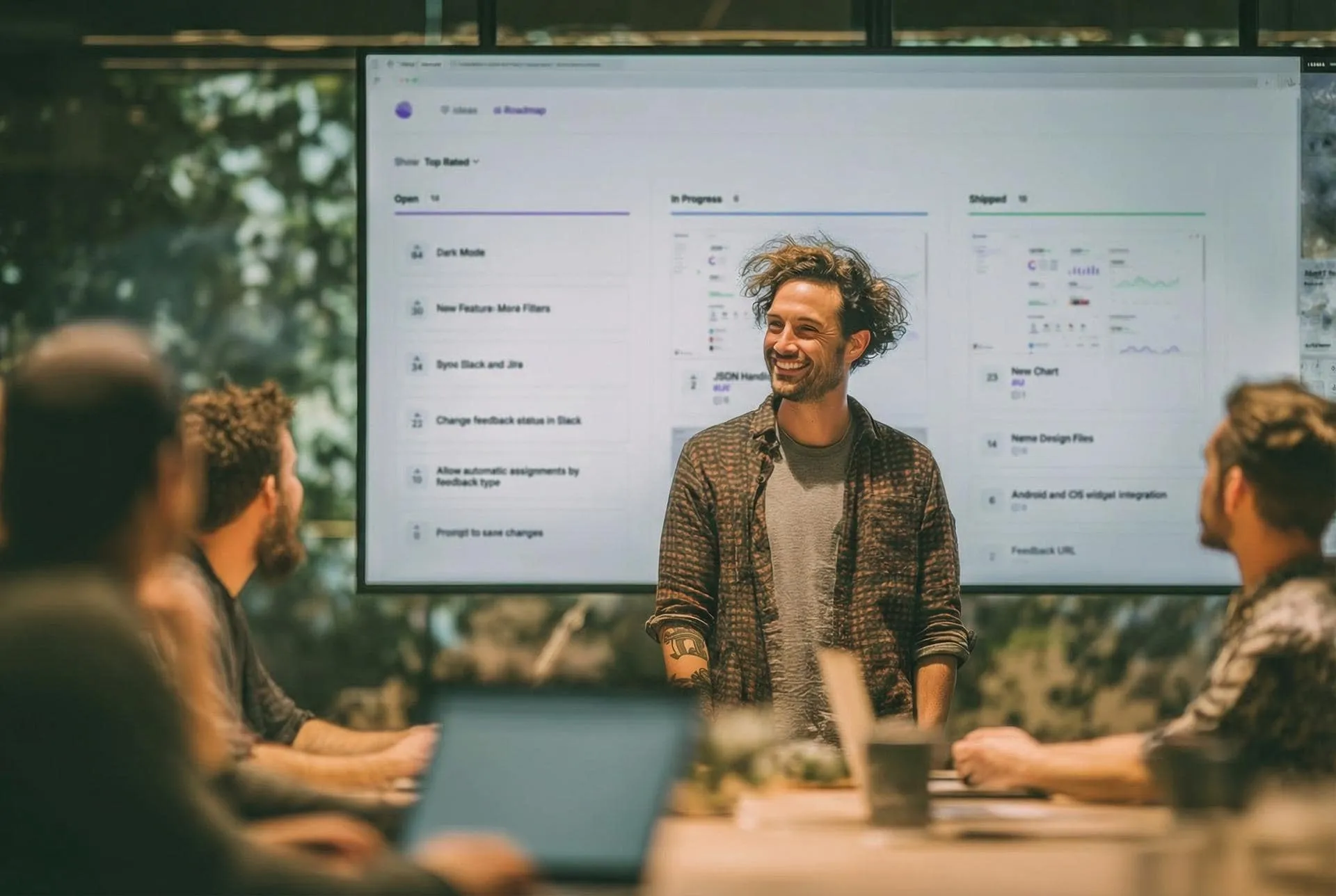 Team reviewing user feedback on a screen